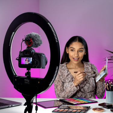 Make up artist filming themselves using a Kenro Ring Light